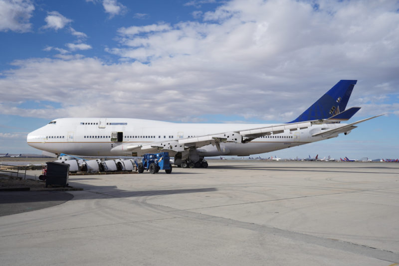 a large white airplane on a runway