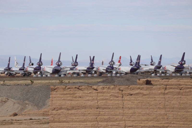 a group of airplanes parked on a field