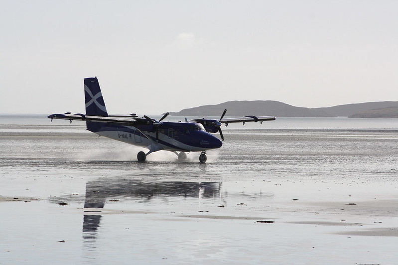 a plane on a wet beach