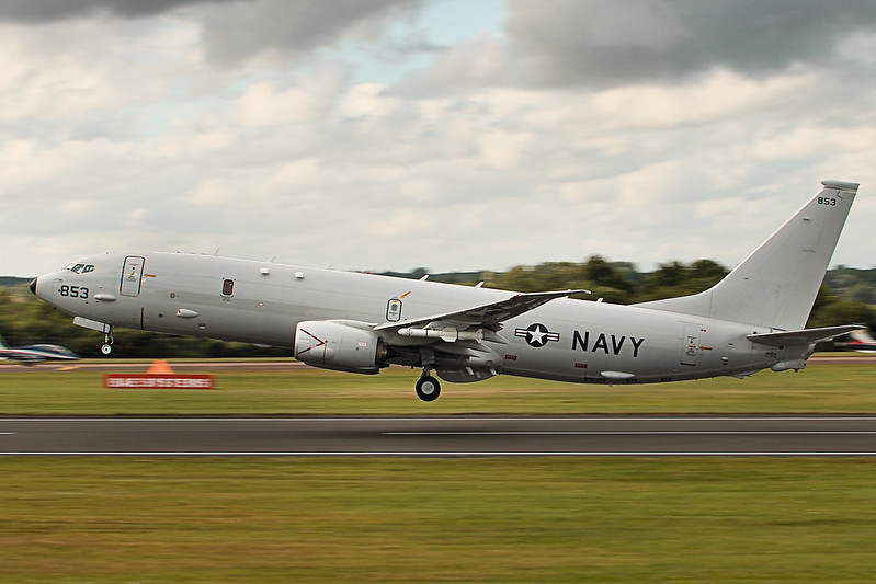 a military airplane taking off