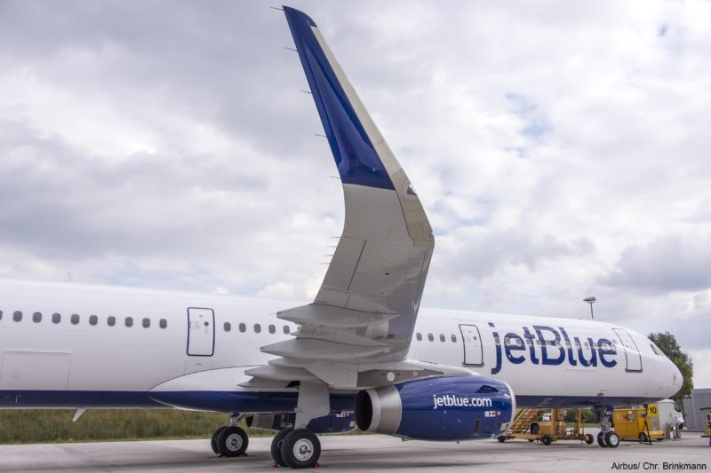 a jet plane parked on a runway