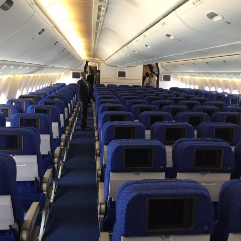 a plane with rows of blue seats
