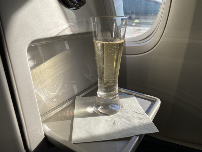a glass of champagne on a tray