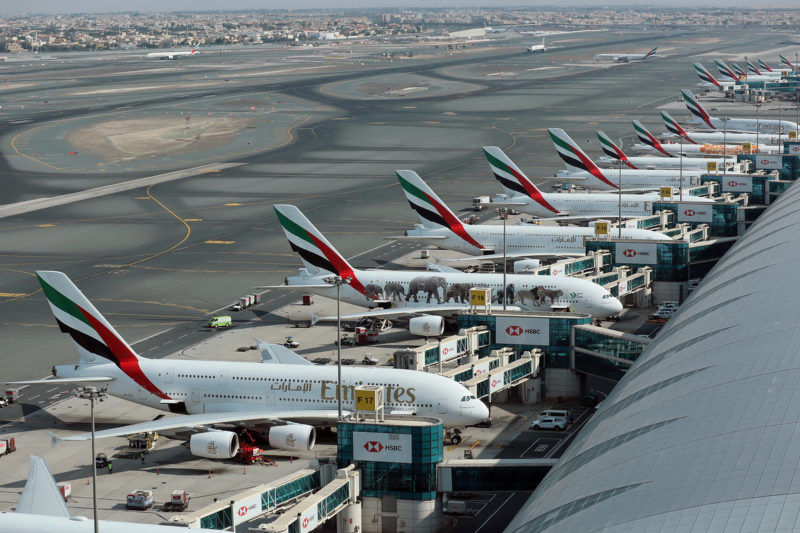 a group of airplanes at an airport