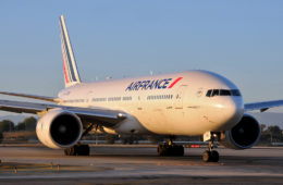 a large white airplane on a runway