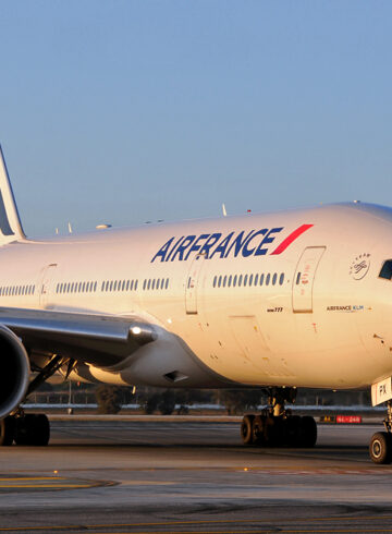 a large white airplane on a runway