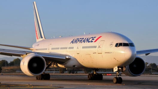 a large white airplane on a runway