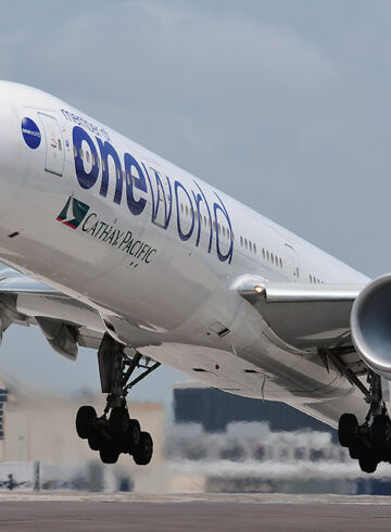 a large white airplane taking off