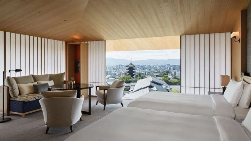 a room with a view of a city and a tall tower