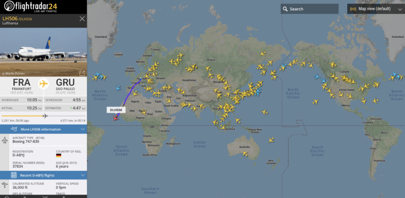 a map of the world with many yellow airplanes