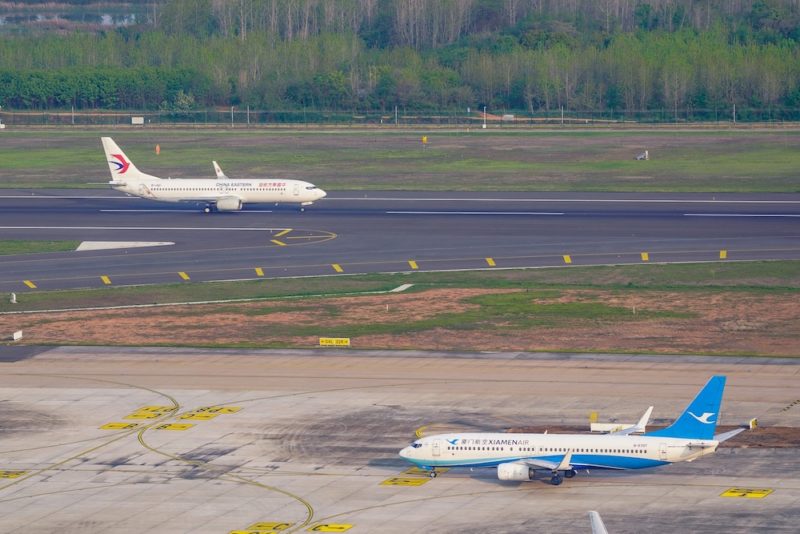 two airplanes on a runway