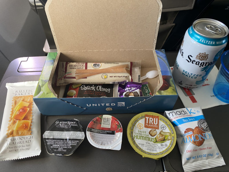 a box of snacks and a can of soda