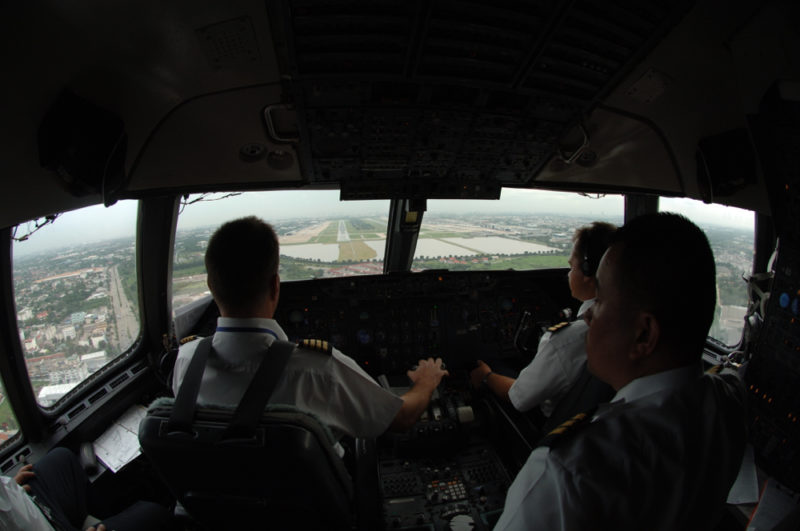 a group of pilots in a cockpit