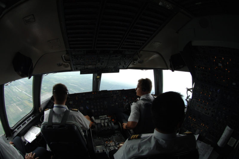 a group of pilots in a cockpit