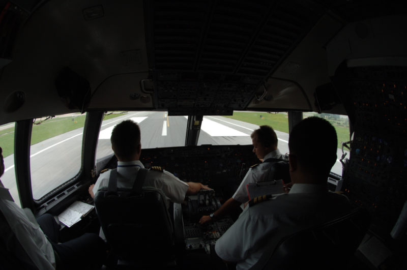 a group of pilots in a cockpit