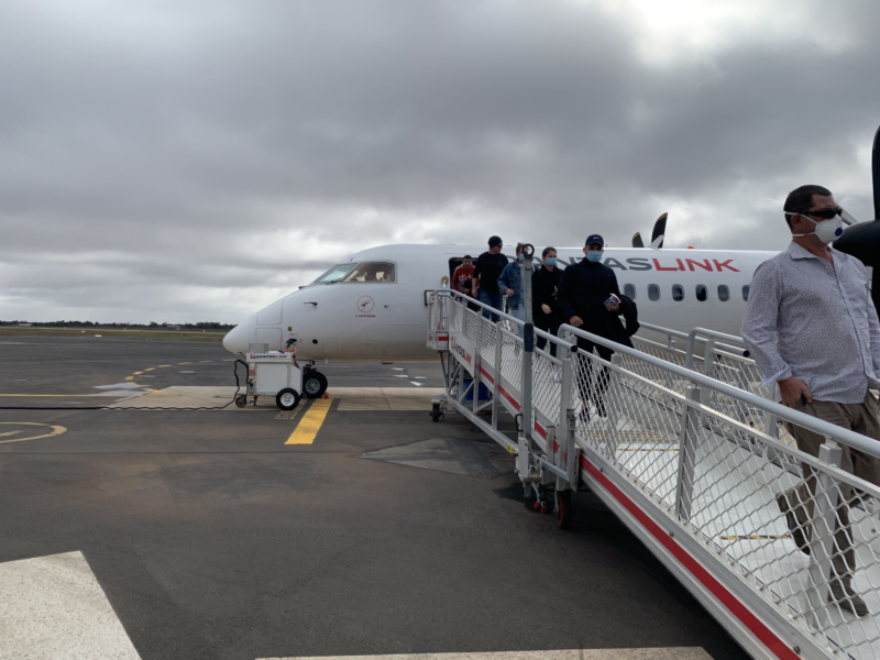 passengers disembarking a plane