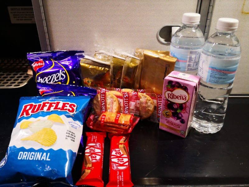 a group of snacks and water bottles