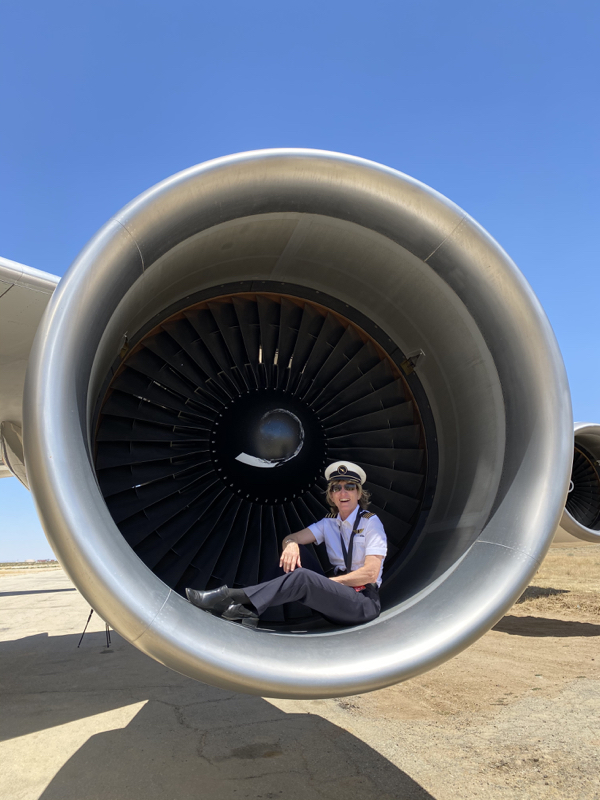 a woman sitting in a jet engine
