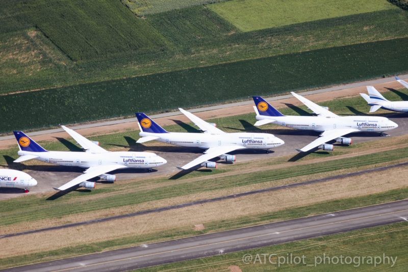 a group of airplanes on a runway