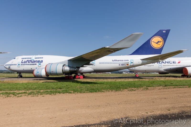 a large white airplane on a runway