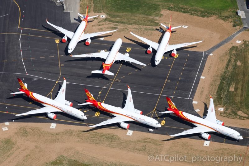 a group of airplanes on a runway