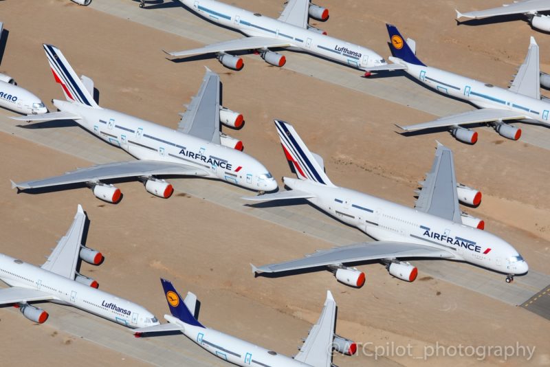 a group of airplanes parked on the ground