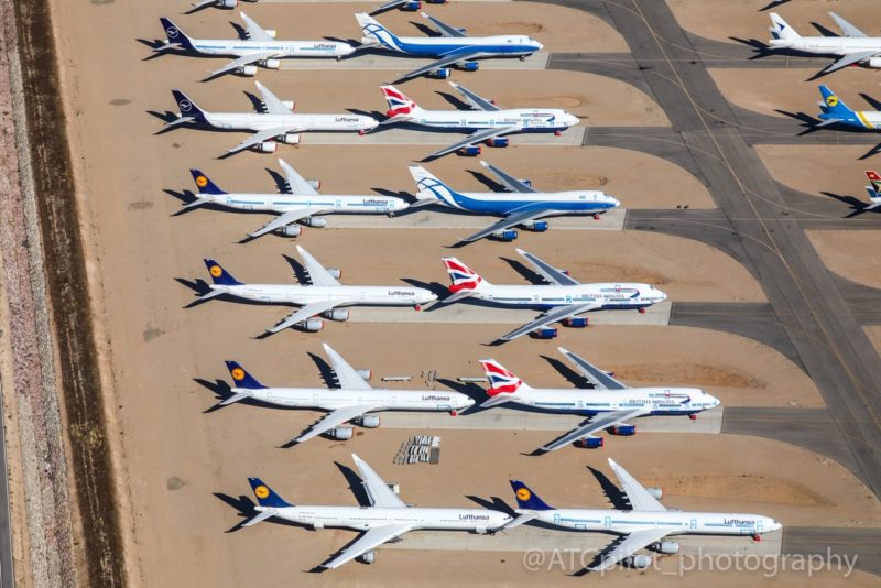 a group of airplanes parked on the ground