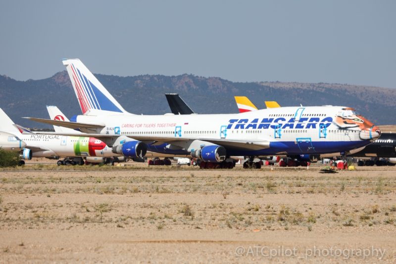 a group of airplanes on a runway