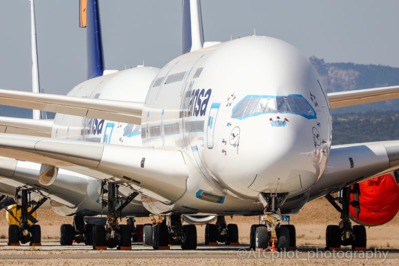 a large white airplane on a runway