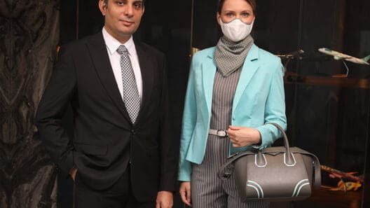 a man and woman wearing face masks
