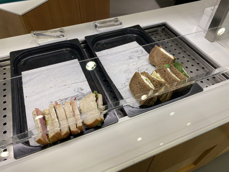 sandwiches on a tray with paper towels and napkins