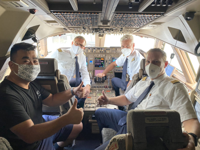 a group of men in a plane with masks