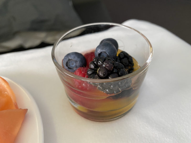 a glass cup with fruit in it