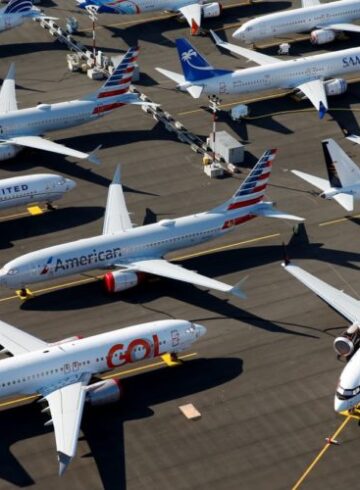 a group of airplanes parked on a runway