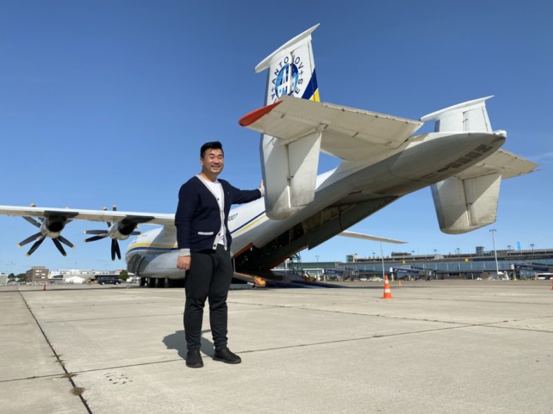 a man standing in front of a plane