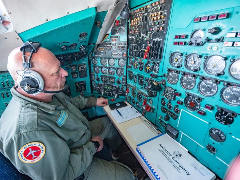 a man in a pilot's cockpit