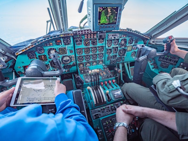 a person in the cockpit of an airplane