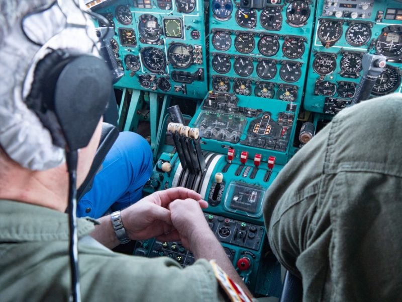 a man in a pilot's cockpit