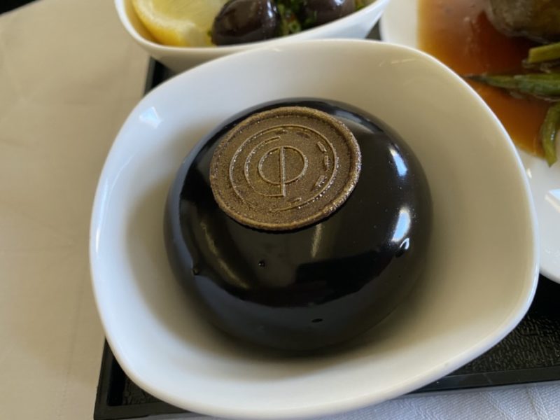 a round black object with a brown circle on top