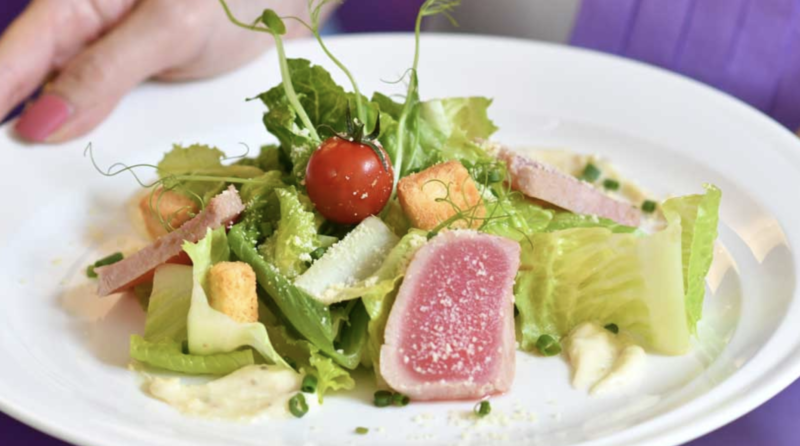 a salad with tuna and croutons