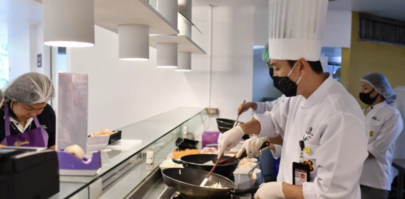 a group of chefs cooking food