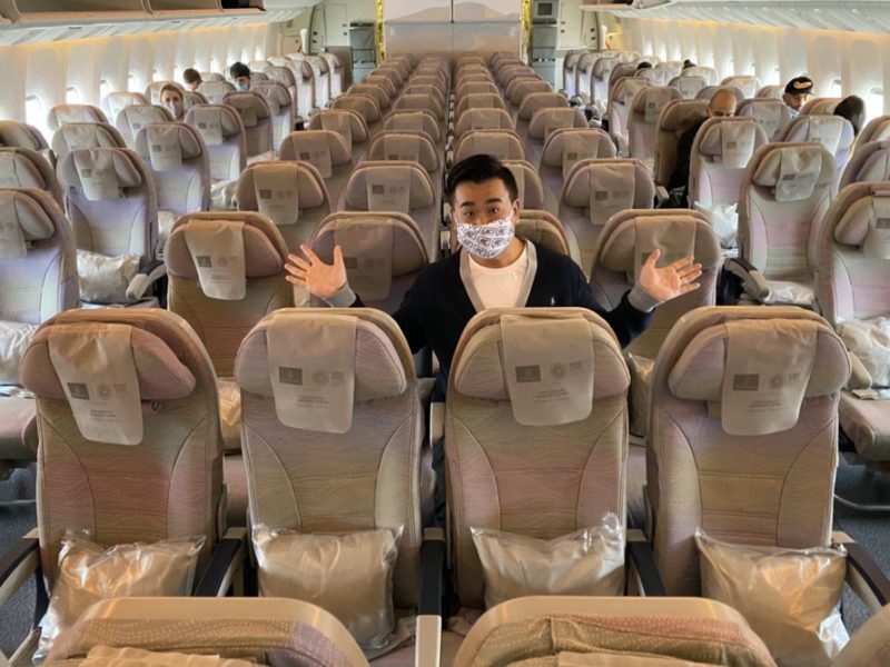 a man in a mask on an airplane