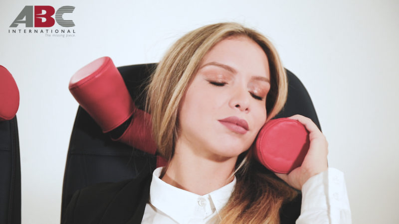 a woman holding a red object