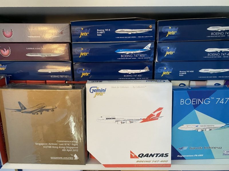 a shelf with boxes and planes