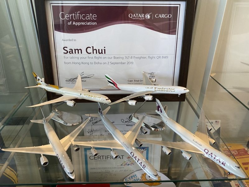 a group of airplanes on a glass shelf