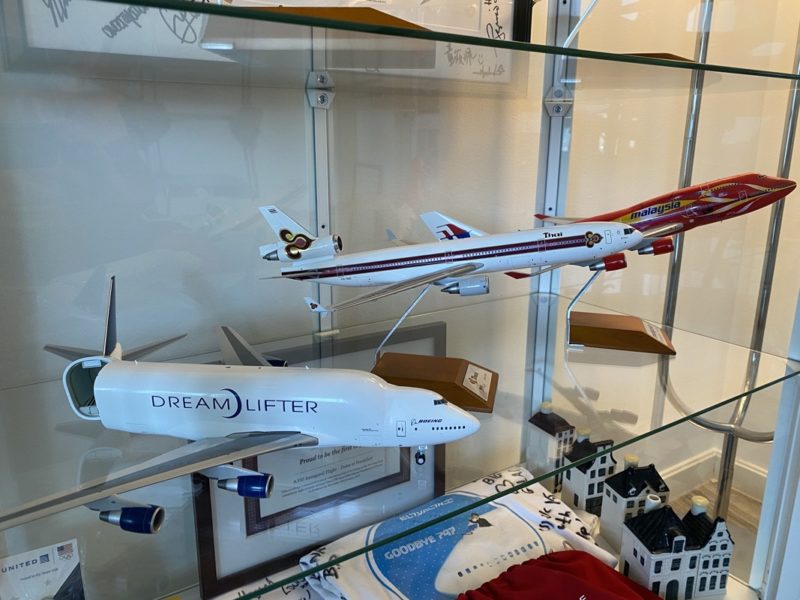 a group of model airplanes in a glass case