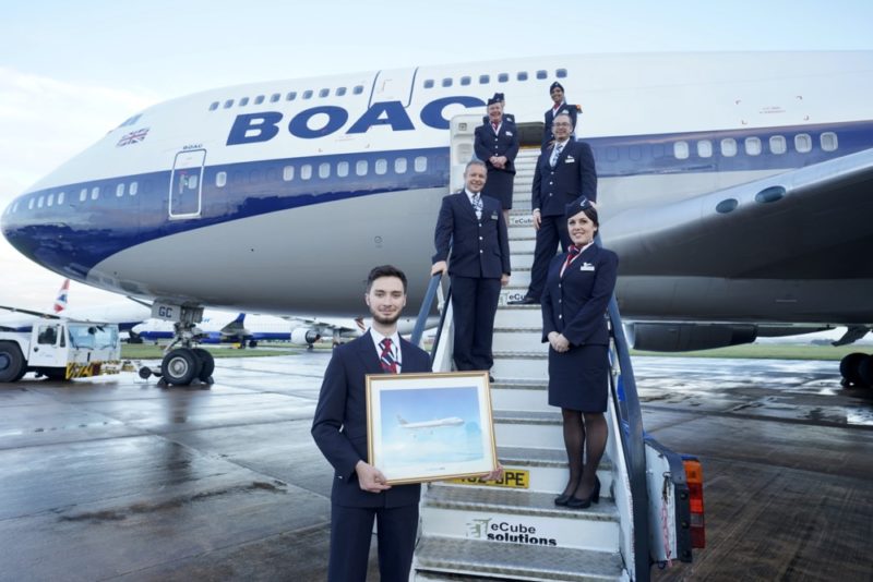 a group of people standing on stairs with a picture of an airplane
