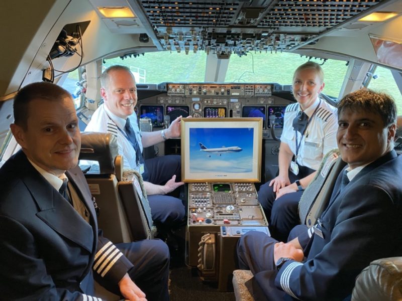 a group of people in the cockpit of an airplane