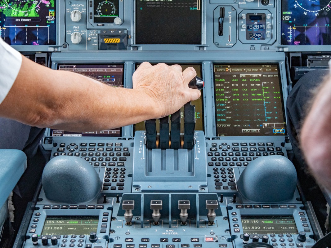 a hand on a control panel