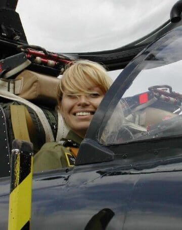 a woman in a pilot's seat